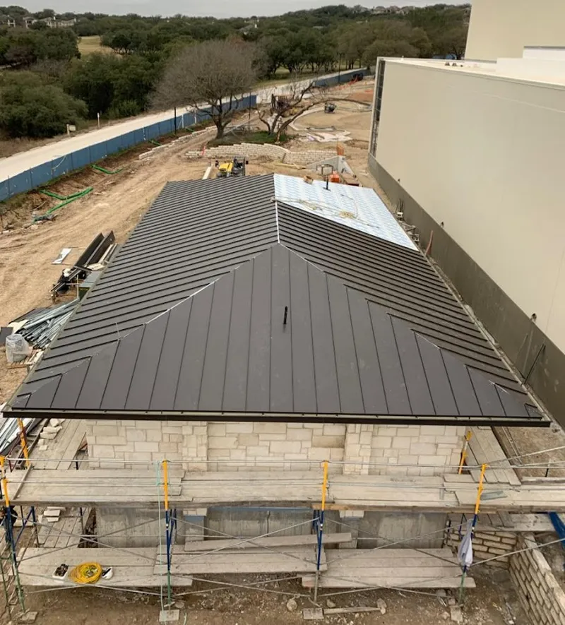 Metal roof new construction with scaffolding in Salisbury
